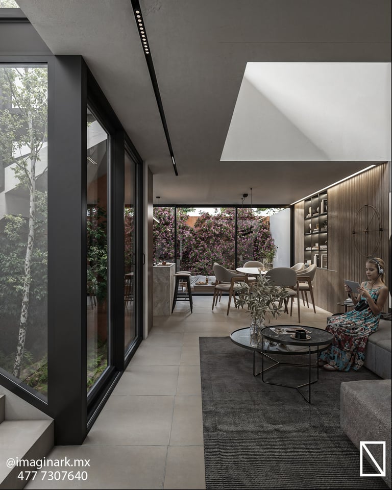 Espacio interior moderno con ventanales negros y vista al jardín