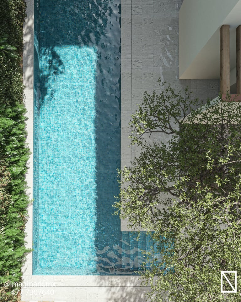 Vista aérea de piscina rectangular moderna con agua turquesa y deck de concreto