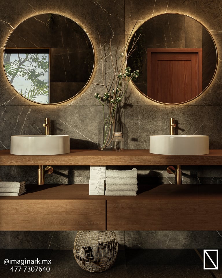 Baño moderno con dos espejos redondos iluminados y lavabos blancos